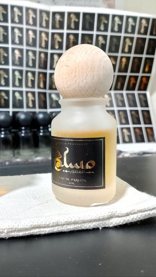 “MIX  SAADA  perfume bottle 50ml with crystal cap surrounded by pomegranate, musk, strawberry, raspberry, and Burberry Her floral fruity notes in a bright pink, clean, joyful atmosphere.”